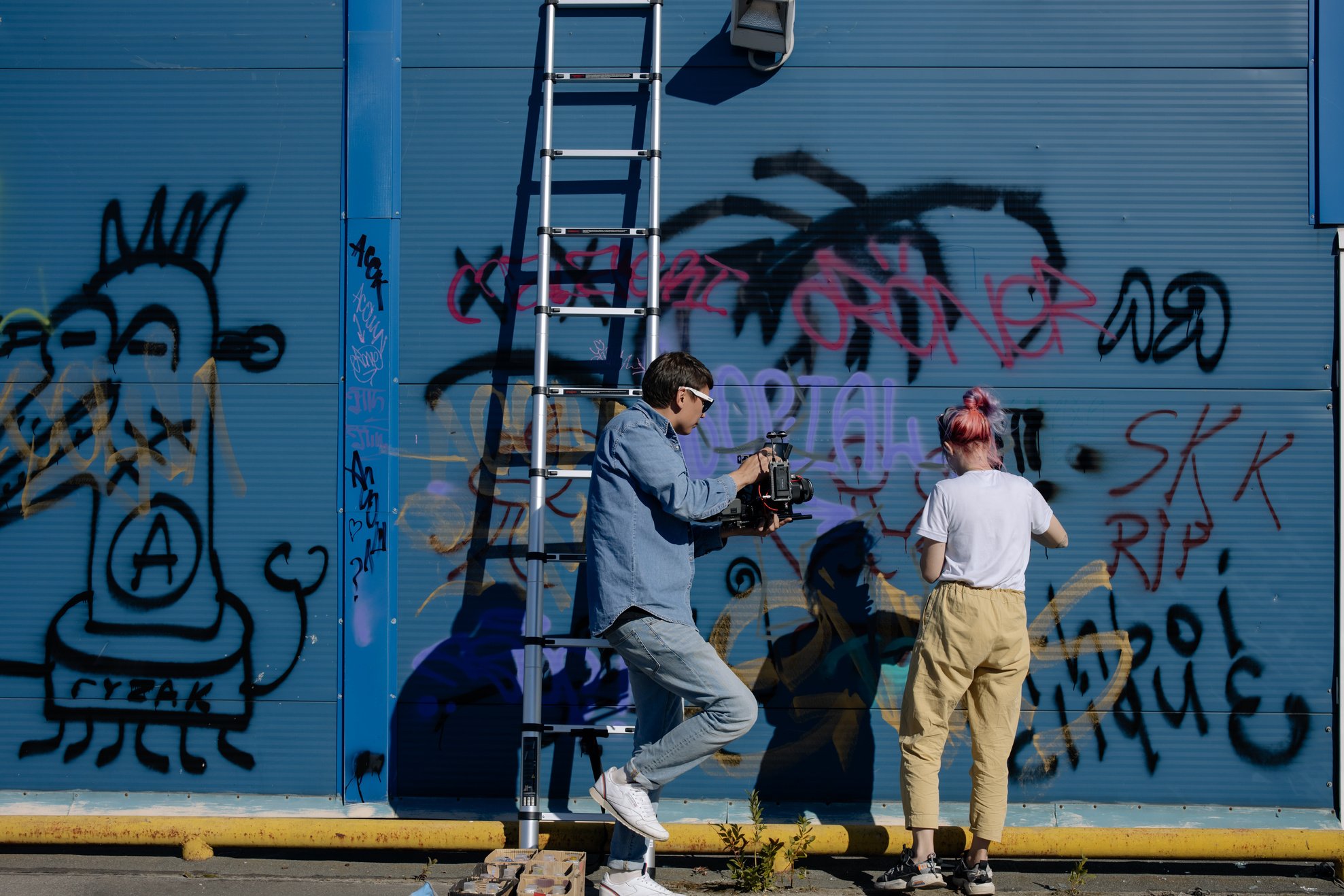 People Vandalizing a Wall